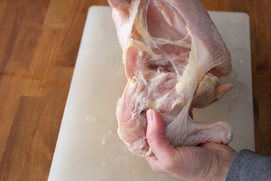 cutting up a whole chicken removing the thigh