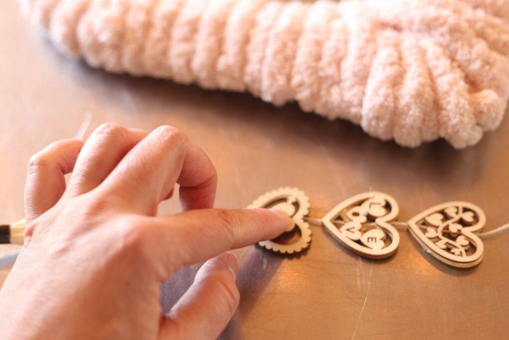 Gluing hearts for wreath