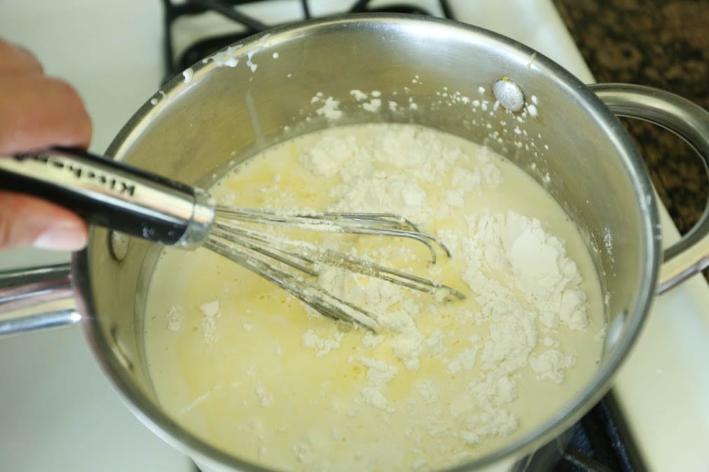 whisking coconut pie ingredients