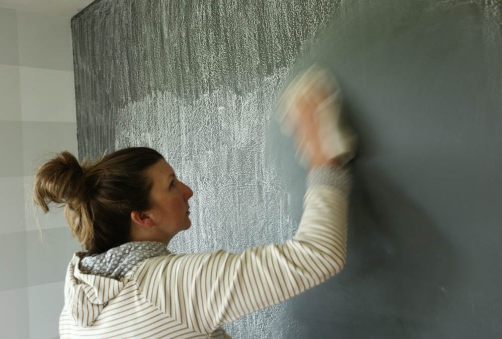 wiping chalkboard wall