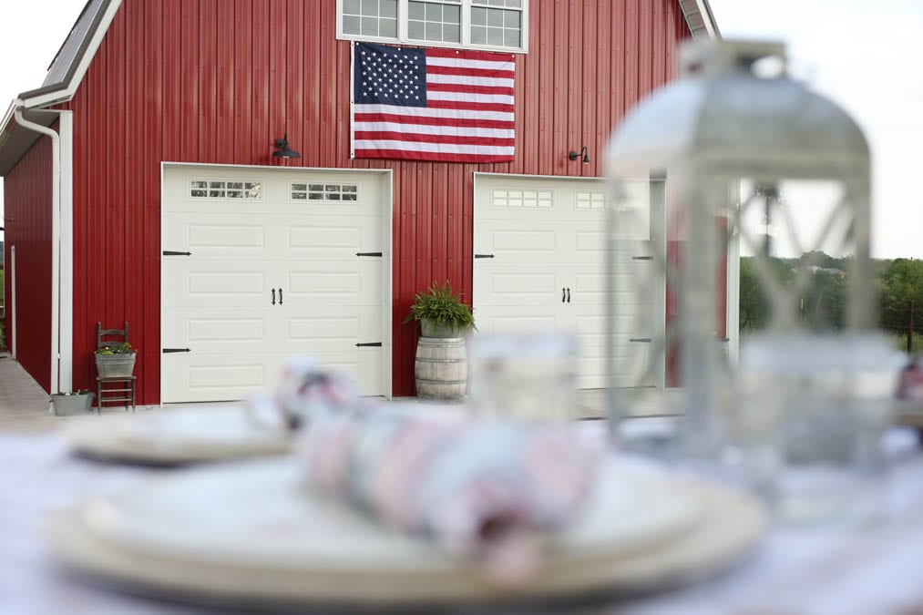 American flag on a red barn