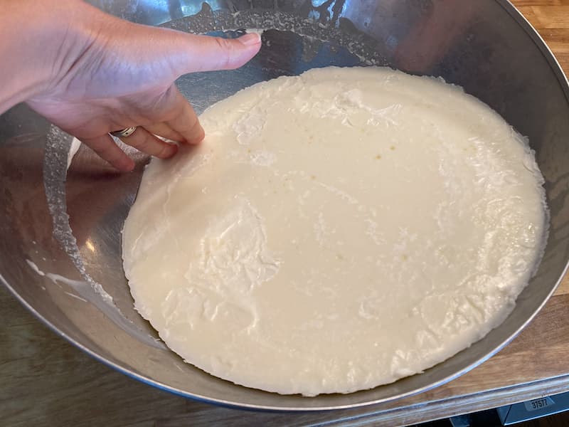 After the tallow has turned hard, remove it from the bowl and flip it over.  You will see lots of gunk and impurities on the bottom.  Use a knife and scrape the gunky stuff off the bottom.  Discard that.  Next, cut the tallow into chunks and return to the crockpot for a second purifying.  