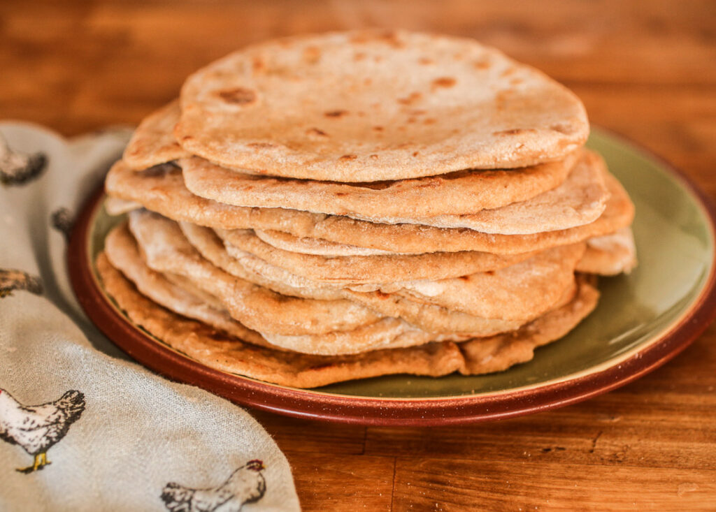 This sourdough flatbread recipe is simple to make and comes together quickly.  Sourdough flatbread is versatile and will take your lunches up a notch!