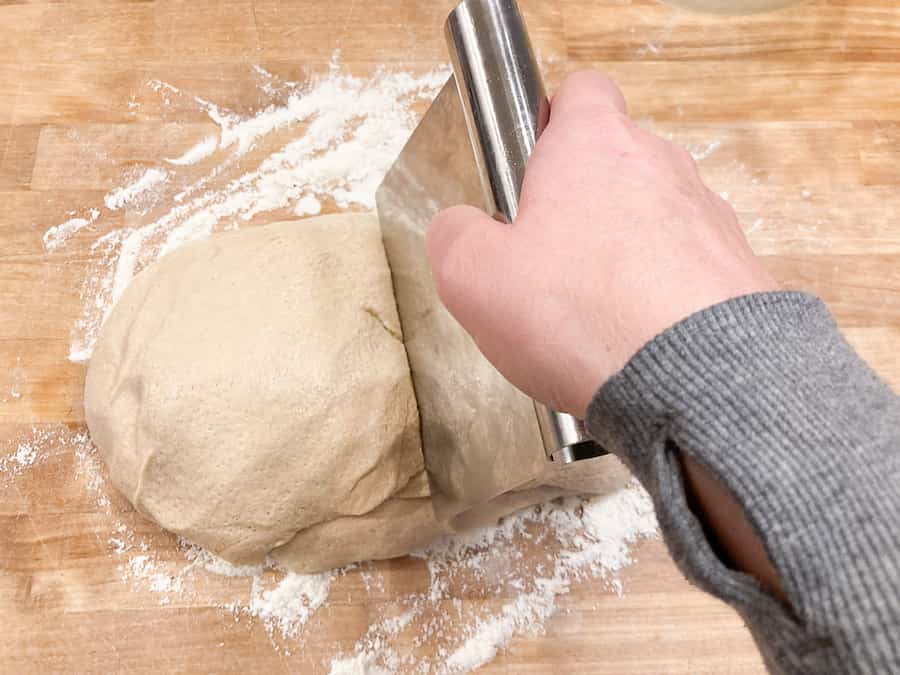 cutting the french bread dough in half