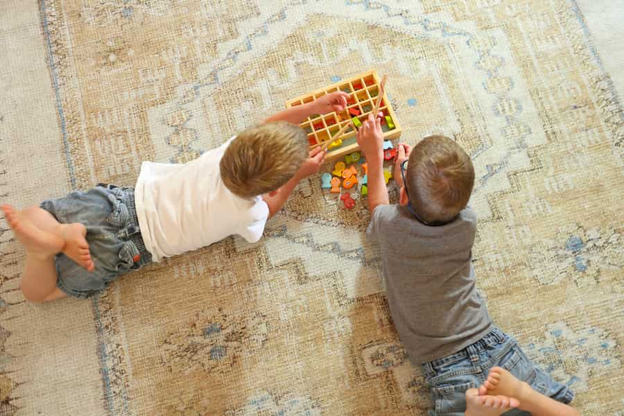 children playing on washable rug