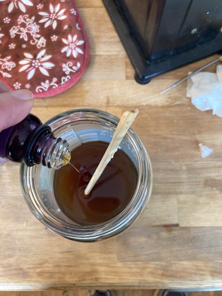 adding fragrance oil to the wax